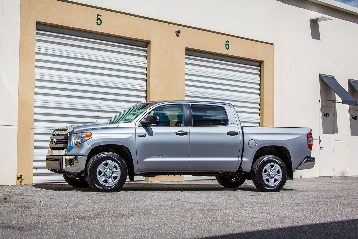 JL Audio SB-T-TCMAX/10TW3 Stealthbox® Custom-fit fiberglass enclosure with two 10TW3-D8 10" subwoofers — for 2014-2021 Toyota Tundra CrewMax